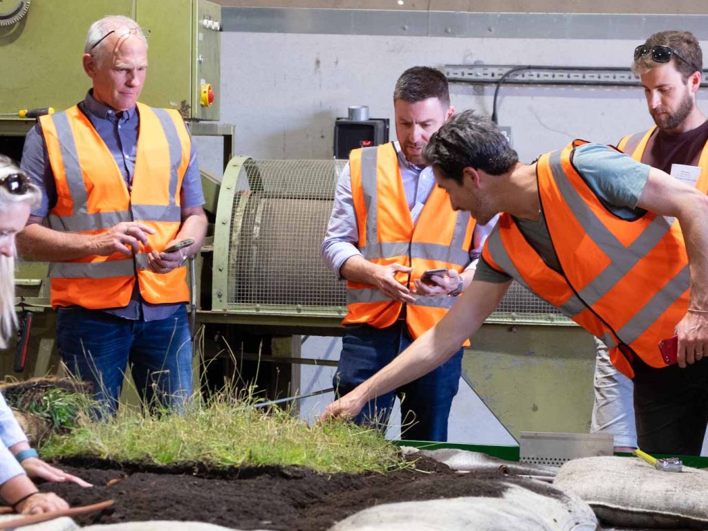 learning to handle Wildflower Green Roof Vegetation mats during a training course